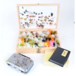 Wooden double fly box with a selection of flies; two plastic double fly boxes with flies; hard