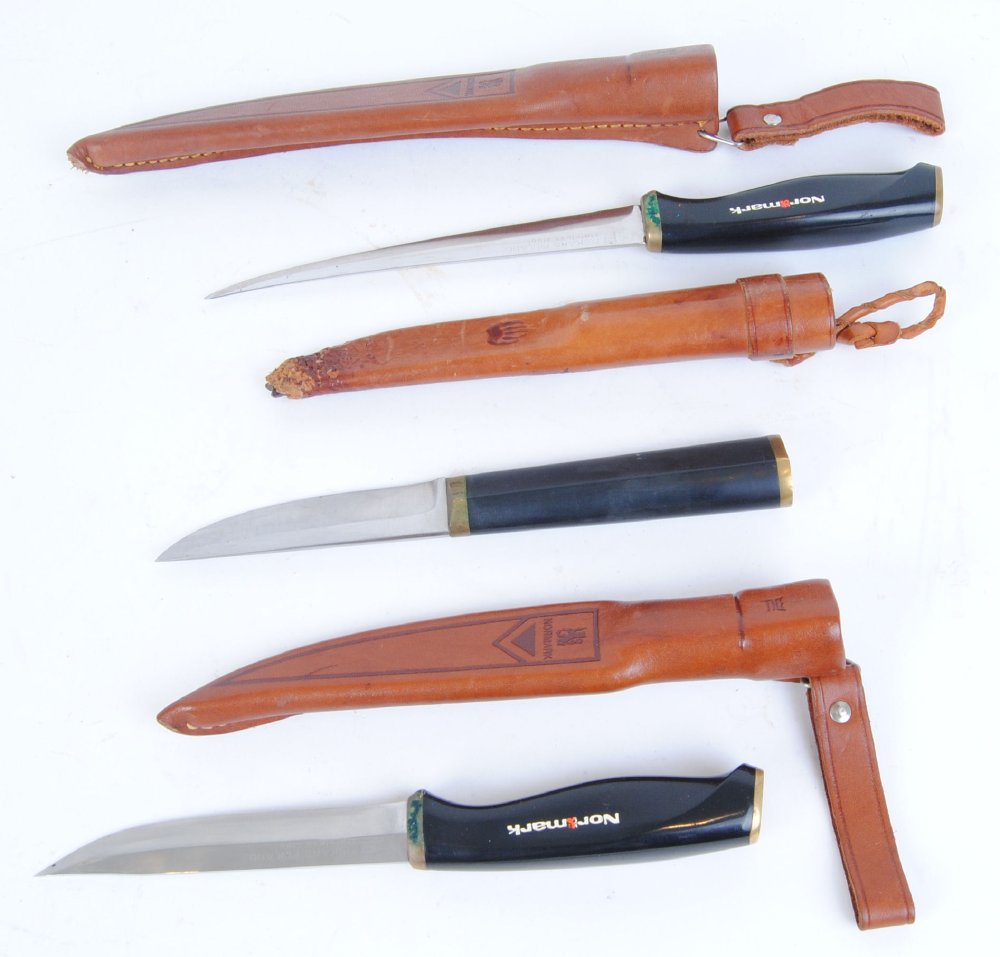 Three sheath knives by Normark and Tapio