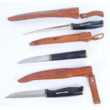 Three sheath knives by Normark and Tapio