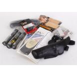 Two boxes of polishing cloths, speed loaders, magazines, holsters, brushes, belts, etc.