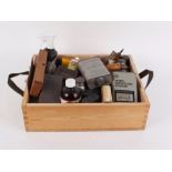 Large box of assorted shooting accessories including cleaning equipment, powder tins, lead moulds,