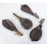 Four various  bag shaped leather shot flasks with brass or steel dispensers