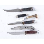 Three sheath knives with compound ring grips; paper knife with staghorn handle; folding knife and