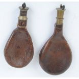 Two bag shaped leather Irish shot flasks with brass dispensers