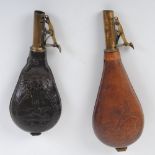 Two bag shaped leather shot flasks with embossed decoration, suspension rings and brass dispensers