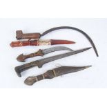 Two eastern Jambiya's and Indo Persian Pesh Kabz dagger, South American sickle with makers name