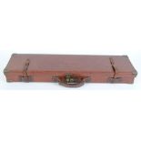 Leather gun case with brass corners and fitted interior for 28 ins barrels