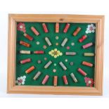 Glazed cartridge display board with 12, 16 and 20 bore cartridges including, Eley Trap Shooting, BSA
