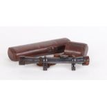 Telescopic sight inscribed G DRGM De Walter Gerard Charlottenburg, with leather covers, quick