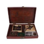 Wooden box containing percussion and other gun components, hammers, sights etc