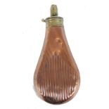 Copper and brass bell shaped powder flask with embossed fluted decoration (dents), secret spring,
