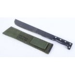 Japanese machete with 13,1/4 ins blade, black rivetted grips, green canvas sheath