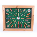 Glazed cartridge display board with .410, 20 and16 bore cartridges etc. by Purdey, Gallyon, Eley,