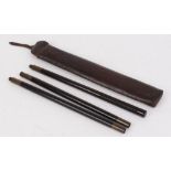 Ebony three piece cleaning rod with brass fittings in leather pouch, 35,1/2 ins