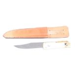 French folding bowie knife with 7 ins blade, brass cross guard and bone grips, in leather sheath