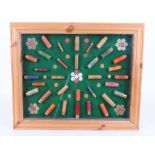 Glazed cartridge display board with .410, 20 and16 bore cartridges etc. by Purdey, Gallyon, Eley,