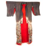 A vintage Japanese Kimono, in grey silk with painted mountainous landscape and scenes having
