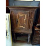 An 18th century Flemish oak cabinet, on later stand, approx 134cm H