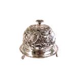 A Sheffield marked silver desk top bell, dated 1898, with pierced and engraved floral design, with