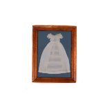 A framed vintage lace dolls dress, together with three various framed and glazed embroidered