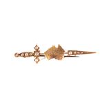 A 9ct gold 1900 Australia brooch, in the form of a sword with half cut pearl decoration with the