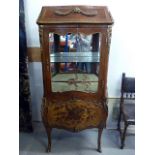 A 19th century French display cabinet, of bombe shape, with walnut bow fronted lower section, having