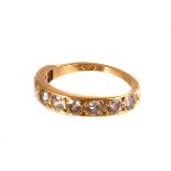 An 18ct gold diamond half eternity ring, the nine round cut diamond set in the 18ct gold band,