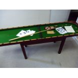 A Riley's folding Bagatelle table on stand, complete with cue and balls, instruction manuals,