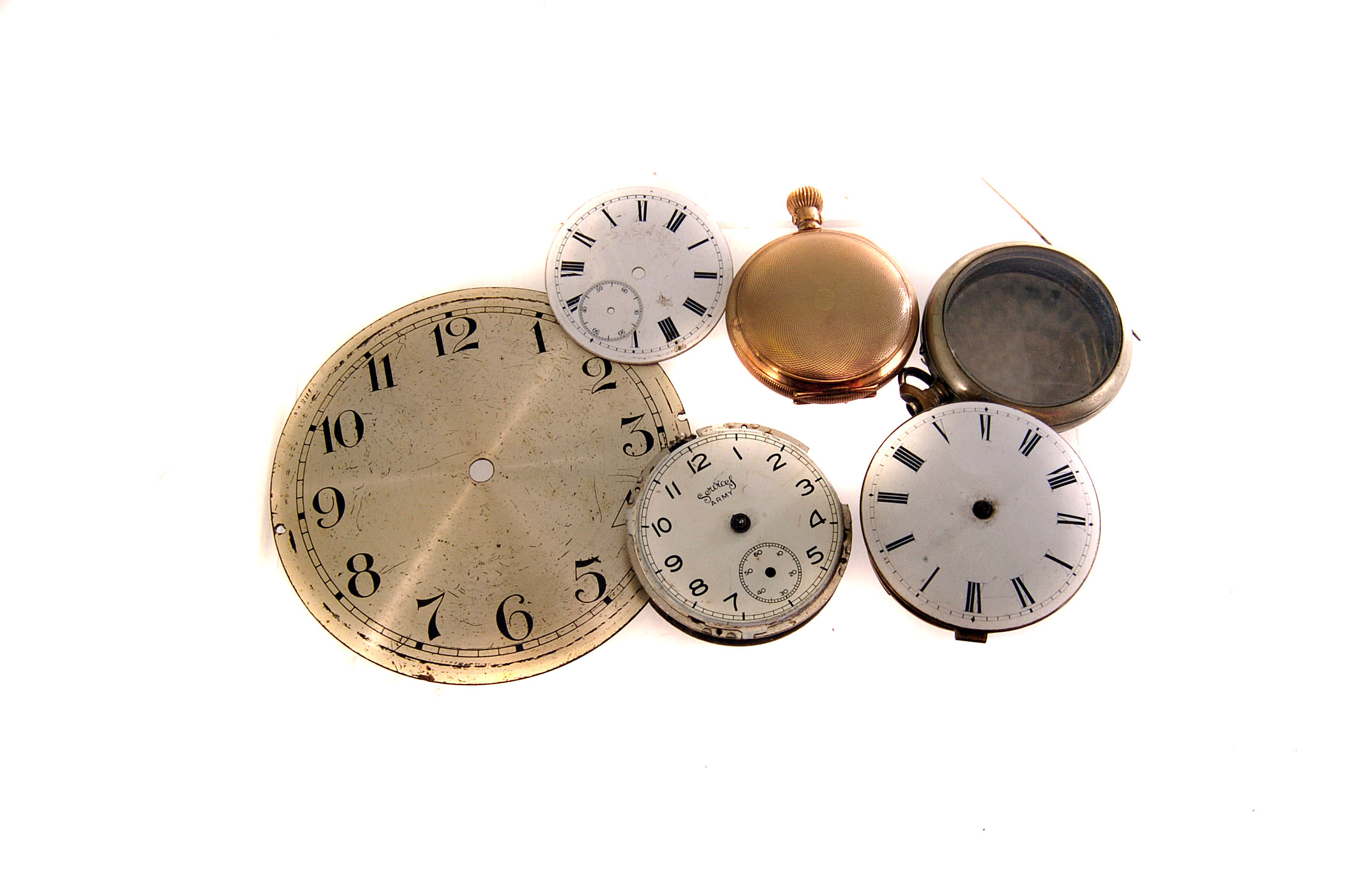 A large selection of pocket watch parts, including a Victorian silver case, a Georgian fusee