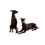 Two bronze greyhound figures, one seated, the other laying (2)