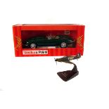 A boxed Tonka Polistil Jaguar MK2 in green, together with Burago Jaguar XK120 Roadster, a Edocar