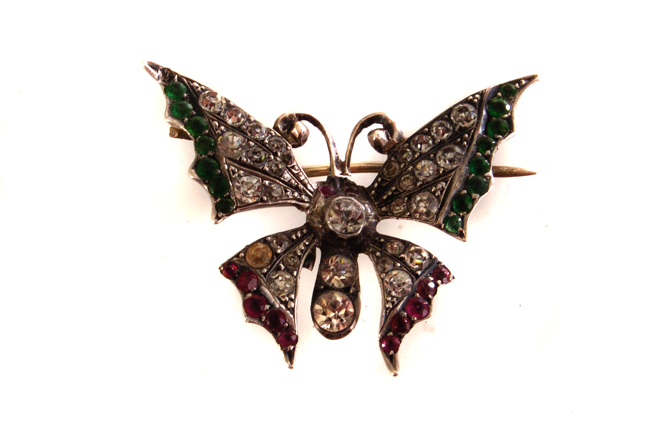 A silver and paste set butterfly brooch, the body and main part of the wings decorated with clear