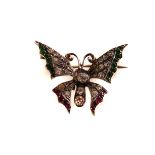 A silver and paste set butterfly brooch, the body and main part of the wings decorated with clear