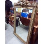 A large Rococo revival gilt framed wall mirror, with later glass, approx 151cm H including frame