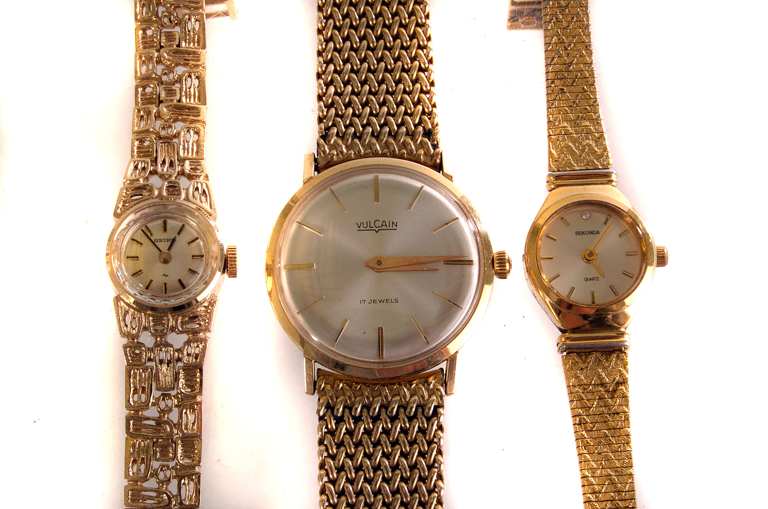 A Vulcain 14ct gold gents wrist watch, with retailers case, together with a yellow metal ladies