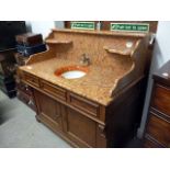 A French marble top walnut wash stand, circa 1900, complete with faucet and pivot mounted