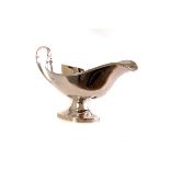 A modern silver sauceboat from J.B. Chatterley & Sons, having reeded foot and handle, dated