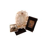An architectural pressed picture frame, housing a religious print, together with an alabaster