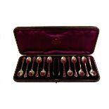 A cased set of Sheffield marked silver spoons and tongs, the 1890 dated set comprising twelve spoons