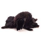 A fur muff, the small black pelt lined with hand sleeve to reverse