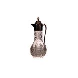 A silver and cut glass jug, the silver top and handle marked Birmingham 1988, engraved 'The