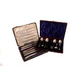 A London marked cased set on six spoons and tongs, together with a Birmingham George V example, plus