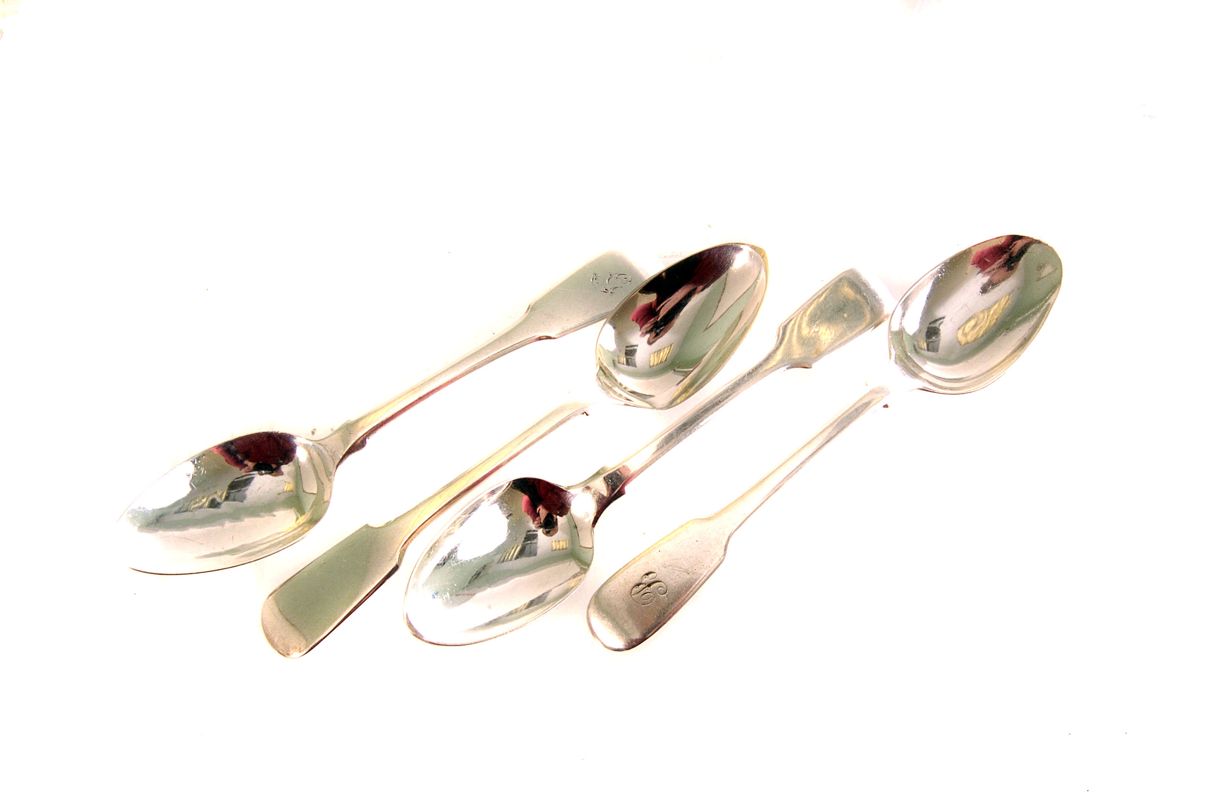 A group of twelve Georgian and Victorian silver teaspoons, fiddle pattern, some with monogram G,