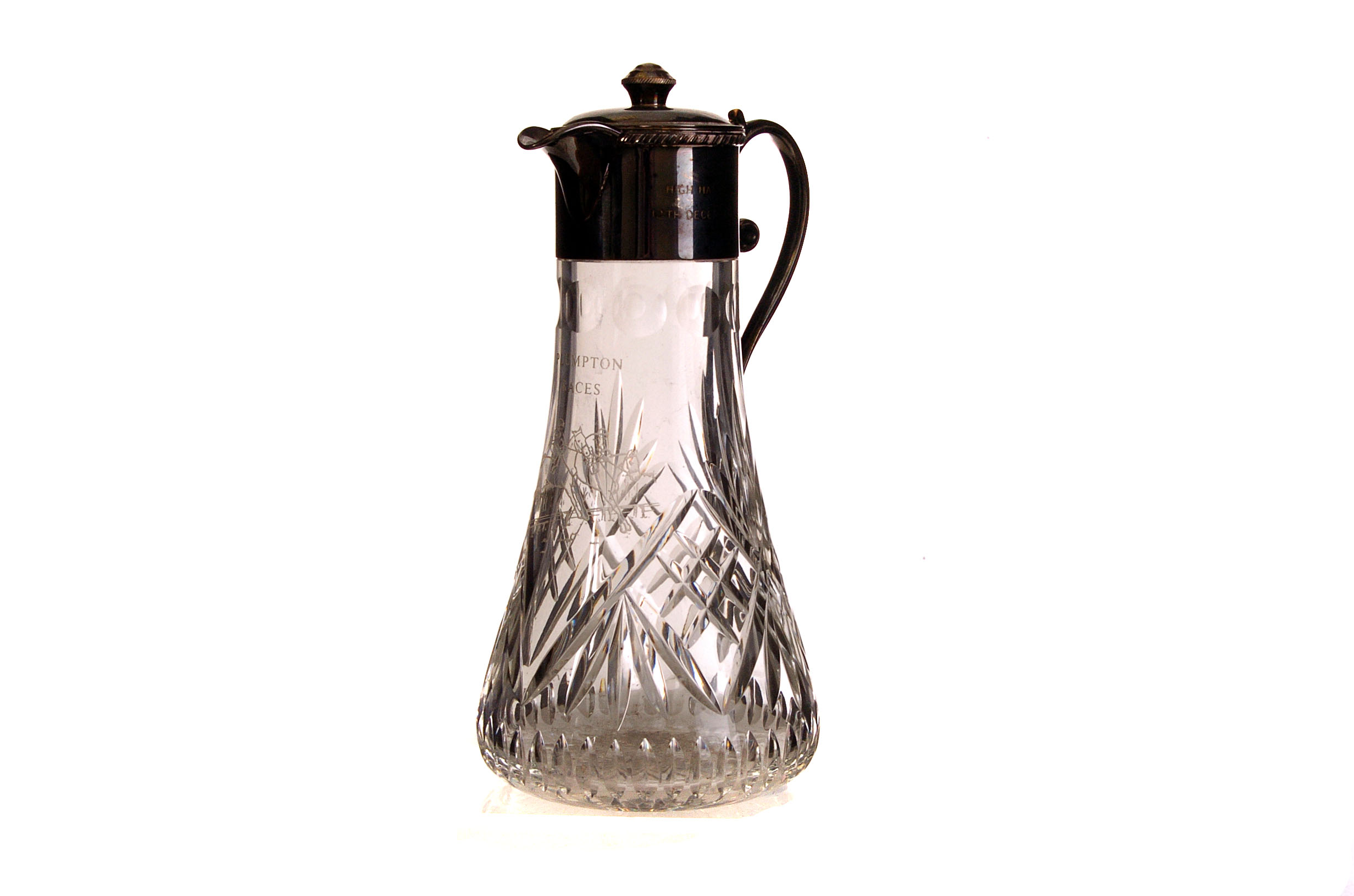 A silver plated and cut glass horse racing jug, the  cut glass having engraved design for Plumpton