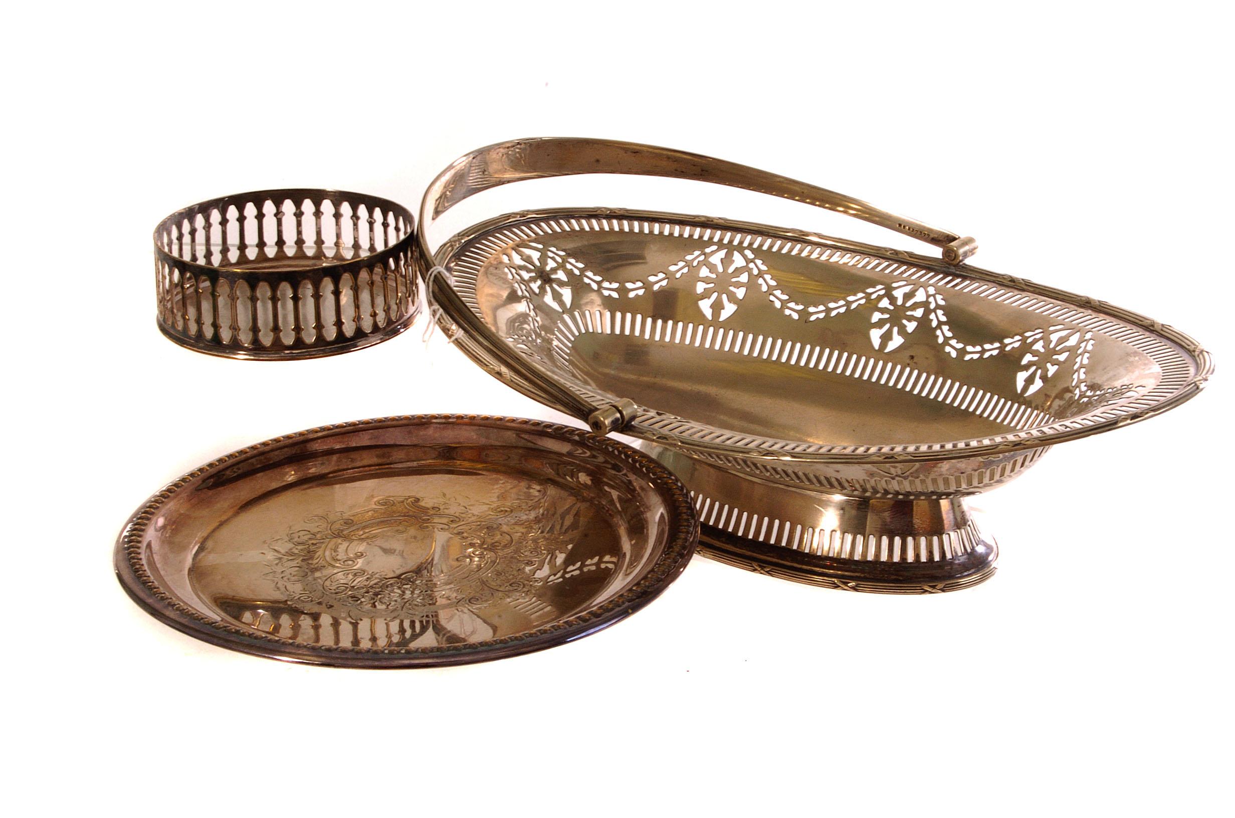 A plated serving basket, with pierced design and handle, together with a plated coaster and a silver