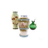 A tapered Victorian green opaque glass vase with floral design,  together with a white opaque