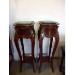 A pair of Louis XV style marble top plant stands, in kingwood veneer, having gilt mounts, green