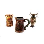 A continental pottery decorative jug with floral design, with ornate handle, together with a