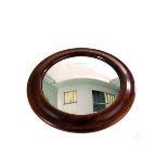 A convex captain's wall mirror, with natural wood frame, approx 38cm diameter including frame