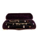 A cased wooden flute, the flute comprising of three parts, in fitted carry case, AF